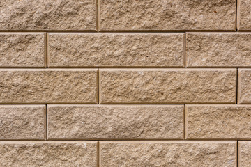 full frame image of beige stone wall background