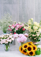 Beautiful flowers on grey, stone background