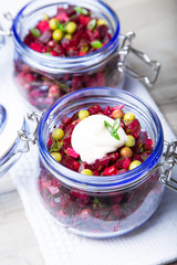 Vinaigrette salad with mayonnaise in a jar. Selective focus, close-up.