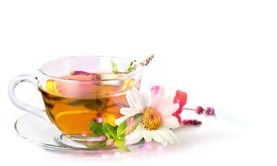 Glass cup of tea with daisy flower