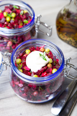 Vinaigrette salad with mayonnaise in a jar. Selective focus, close-up.