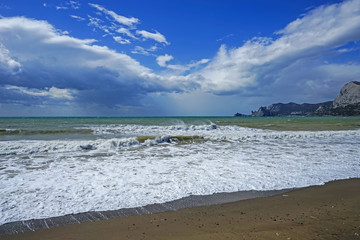 Marine landscape with a beautiful emerald waves. Sudak, Crimea.