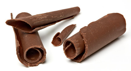 Dark chocolate curls isolated on white background