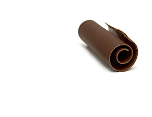 Dark chocolate curl isolated on white background