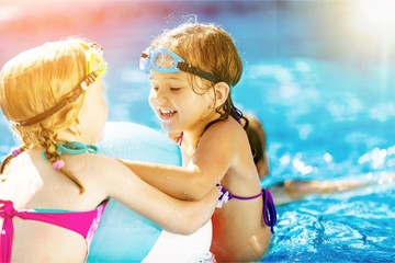 Beautiful little girl sunning at the pool