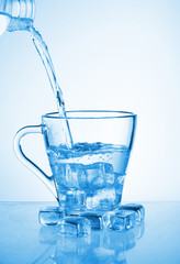 pouring water into a cup