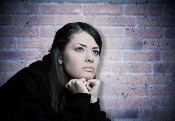 Young woman crying on background