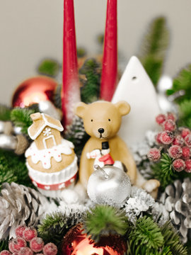 Christmas decoration candlestick with toy teddy bear and gingerbread house