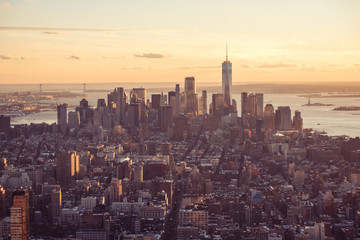 New York City - Manhattan downtown skyline skyscrapers at sunset and twilight. View from Empire State Building Platform. USA.