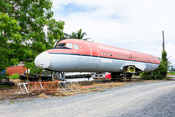 Fototapeta premium Closeup of abandoned airplane beside the road at Chiang Mai,Thailand