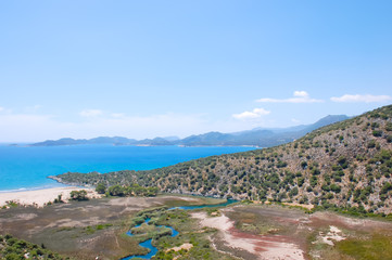 Beautiful landscape of the confluence of the winding river and the sea
