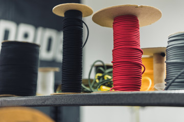 close up view of various sewing strings at tailor workshop