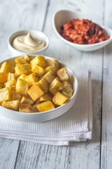 Portion of patatas bravas with sauces