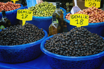 Turkish farmer market. Variety of green and black olives on the counter