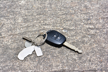 Car key drop on the road background.Car key lost on the road