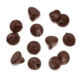 Scattered chocolate chips morsels or drops from top view isolated on white background