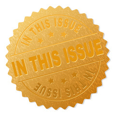 IN THIS ISSUE gold stamp award. Vector gold award with IN THIS ISSUE text. Text labels are placed between parallel lines and on circle. Golden surface has metallic effect.