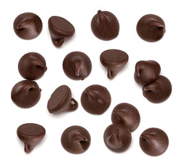 Scattered chocolate chips morsels pile from top view isolated on white background
