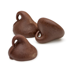 Scattered drops chocolate chips morsels pile closeup view isolated on white background