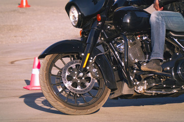 Biker in jeans riding a motorcycle