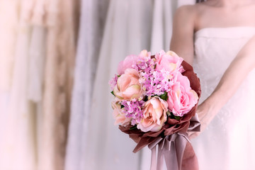 Bride holding beautiful pink wedding flowers bouquet
