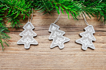 Fir garland with christmas trees on wooden background