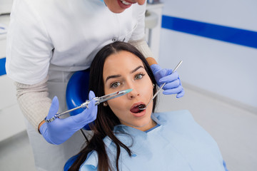 Fototapeta premium Terrified patient at dentist office.