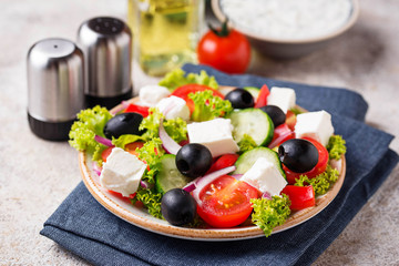 Traditional Greek salad with feta, olives and vegetables