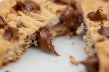 Creamy chocolate filling cookies. Drops of creamy chocolate on homemade biscuit.