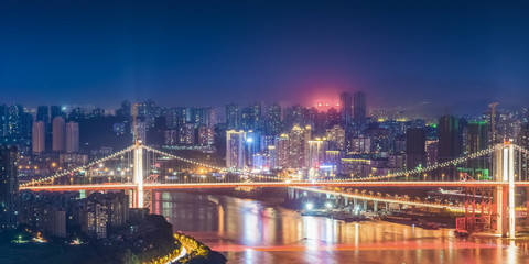 Naklejka na ściany i meble cityscape and skyline of downtown near water of chongqing at night