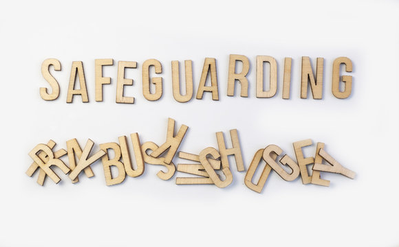 Safeguarding concept, word spelled out in wooden letters