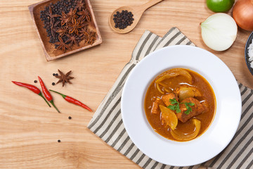 Chicken curry in a bowl / Vietnam chicken curry on wooden background