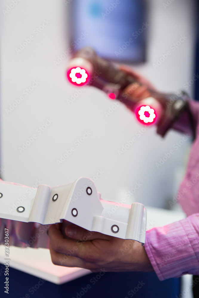 Poster engineer scans the detail with 3d scanner