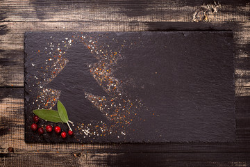 Christmas background, kitchen board is lying on a wooden background, there is a trail of Christmas...