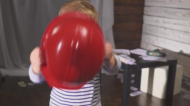 portrait boy builder in helmet smiling