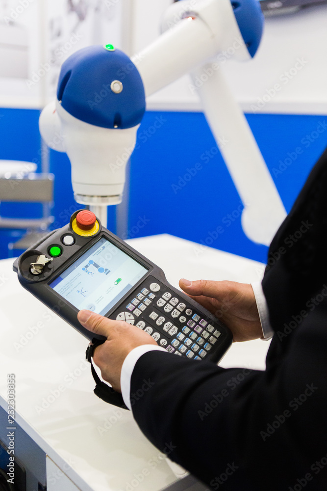 Aufkleber the engineer demonstrates the work of the robot-collaborator