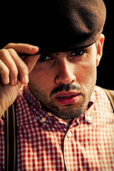 A man touches his hat when meeting another person as a symbol of greetings and respect. Retro...