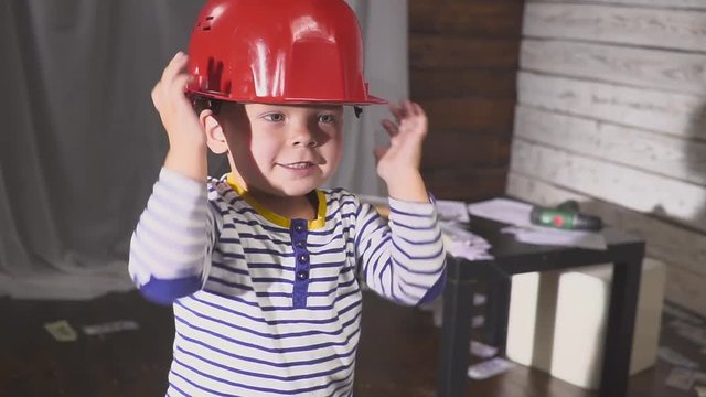 portrait boy builder in helmet smiling