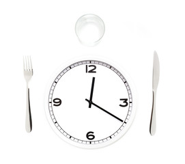 Fork, knife, glass, and white round clock