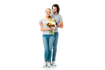 Happy couple hugging and girl holding flowers isolated on white