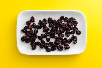 Cranberries on rectangular white plate with rounded corners.