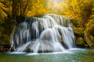 Obraz premium Beautiful waterfalls in the middle of the forest, resulting in complete ecological system of the forest, nature park and outdoor in summer season.