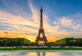 Paris Eiffel Tower and Champ de Mars in Paris, France. Eiffel Tower is one of the most iconic...