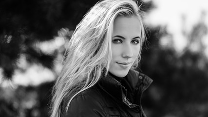 Portrait of young woman at sunny day.