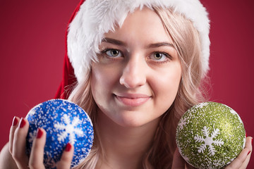 Beautiful girl in Christmas dress. Bright girl with Christmas gifts. Merry Christmas greetings and Christmas discounts.
