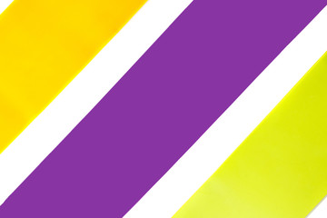 Fitness elastic band, elastic extenders of different colors for sports, isolated on a white background. Fitness trend