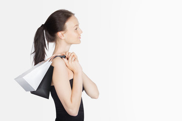 Fototapeta premium Black Friday Sales Concept with Young Woman and White Black Bags