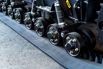 A close up of modern rubber tractor tracks