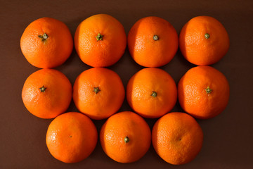 fresh oranges on black background