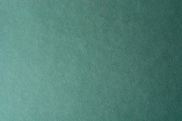 green paper texture background. colored cardboard fibers and grain